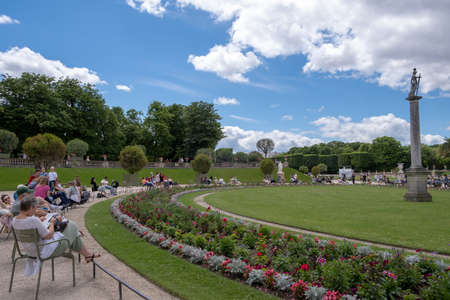 PARIS, FRANCE - JUNE 6, 2022: Tourists relaxing in Luxembourg Garden (Jardin du Luxembourg),second largest Public Park in Paris.のeditorial素材