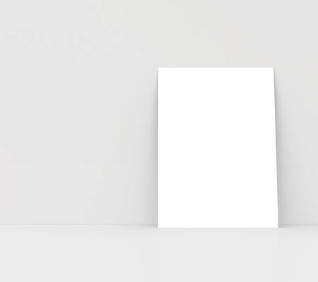 paper card on a white wall  white blank paperの写真素材