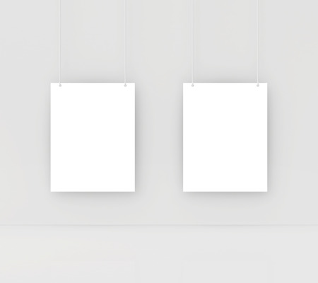 paper card on a white wall  white blank paperの写真素材