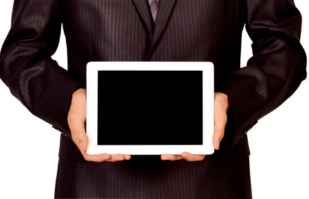 Business man holding and shows touch screen tablet pc with blank screen の写真素材