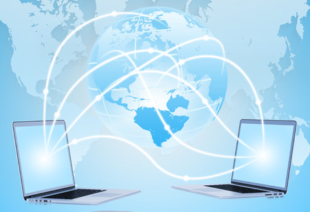 Notebook on the background world map  symbolizing the technology Internetの写真素材