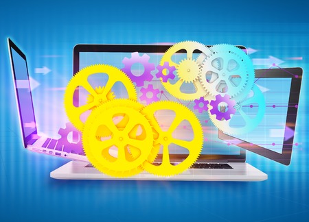 cogwheels, gear flying in front of laptop and a tablet