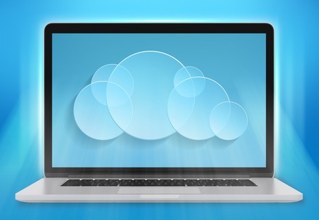 laptop computer and a cloud storage on blue backgroundの写真素材