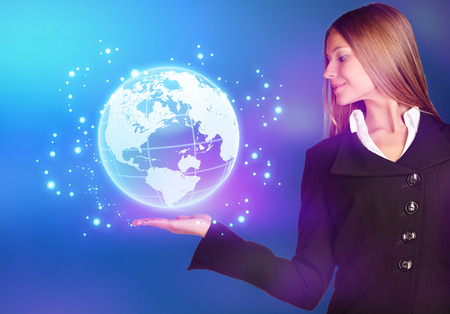 woman showing holding on world map globeの写真素材