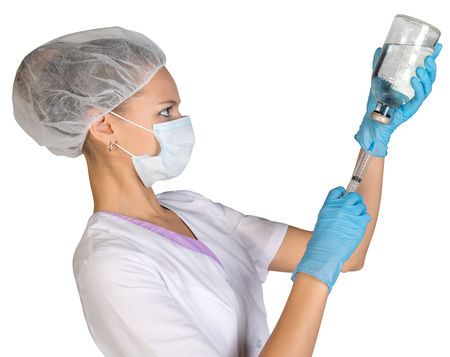 Female doctor picking up the syringe injection.の写真素材