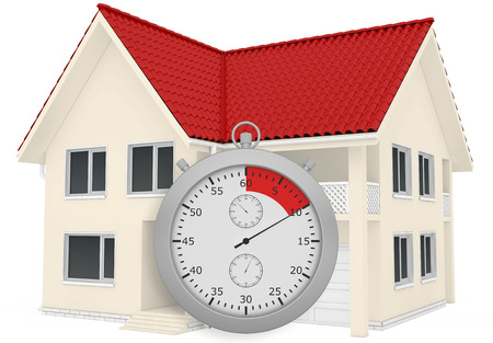 The house with a red roof and a stopwatch in the foreground. Isolated on white background.の写真素材