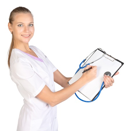 Clip board. Stethoscope. The doctor fills out a medical form.の写真素材