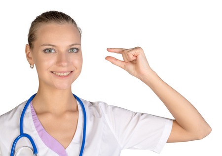 Intern shows hand sign small copy space. white background.の写真素材