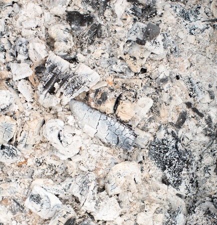 Remains of wood coal and ashes after the combustion of firewood.の写真素材