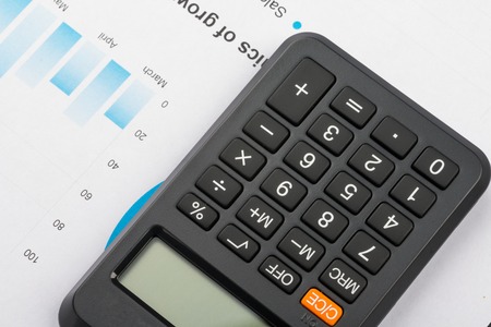 Financial graphs and charts analysis with calculator.の写真素材