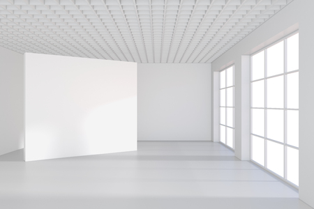 White billboard in an empty office with large windows and beautiful diffused light from the window. 3D rendering.の写真素材