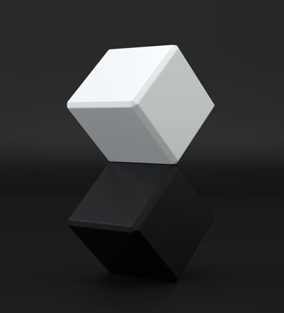 White and black cube on black studio background.の写真素材