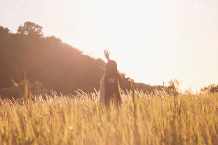 In the autumn sunshine girlの写真素材