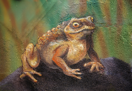 Big brown fairy-tale toad sitting on stone in grass, acryl painting .