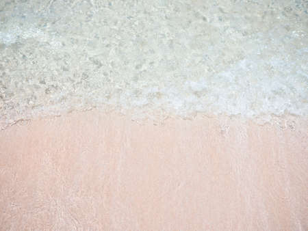 Pink sand beach with clear water wave. Paradise beach in CÃ¡diz, Spainの写真素材