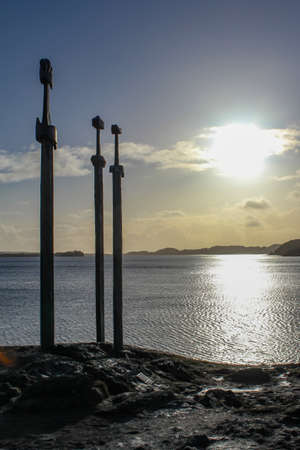 Three iron swords in a rock, sverd i fjell during sunset, Stavanger, Norwayの写真素材