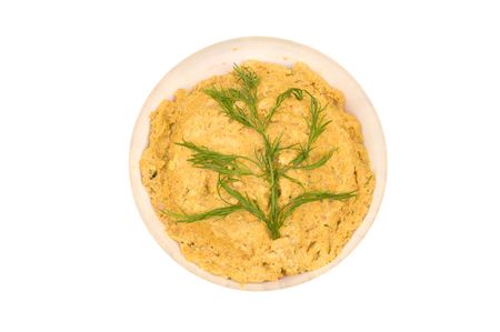 Yellow beans puree in a bowl isolated on whiteの写真素材