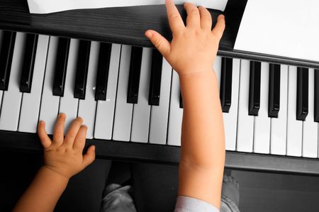 Baby going to play the pianoの写真素材