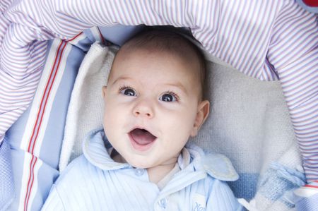 Four month baby boy smiling