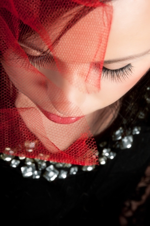 View from above on a beautiful woman with closed eyes, long eyelashesの写真素材