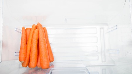 Open fridge filled with fruits and vegetables.の写真素材