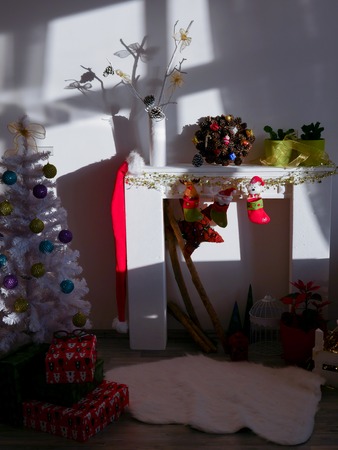 Christmas corner with christmas tree and chimney at day lightの写真素材