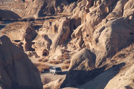 View on Goreme rocks in Cappadocia, Turkey. Traveling by car concept