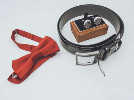 Closeup of golden wedding rings in decorative champagne glass on table of glass and woodの写真素材