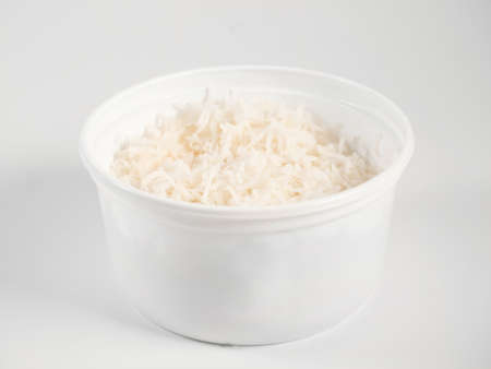 Simple prepared basmati rice in white plastic food box for take out on white backgroundの写真素材