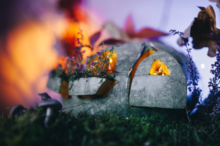 Beautiful autumn pumpkin lantern with colourful lightning. Homemade autumn decoration, carved pumpkinの写真素材