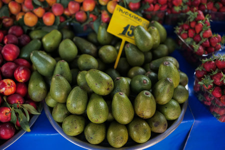 Avocado fruits on the counter of a grocery store. Close-up.