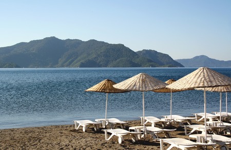 Canvas chairs on the beach の写真素材