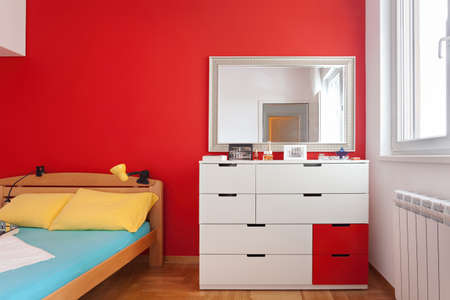 Cozy modern colorful bedroom interior with bed sheet and geometry shapes design