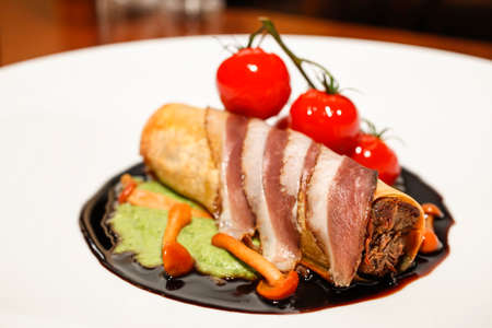 Exclusive dinner plate with Goose pate roll, Enokitake mushrooms, cherry tomatoes and soy sauce
