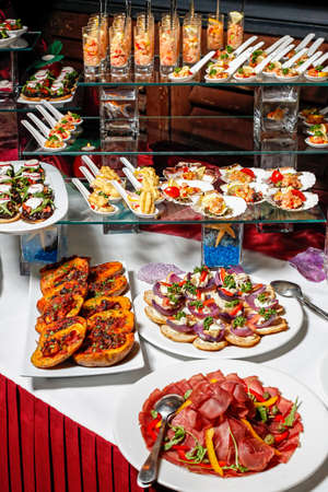 Variety of arranged party finger food - cold buffetの写真素材