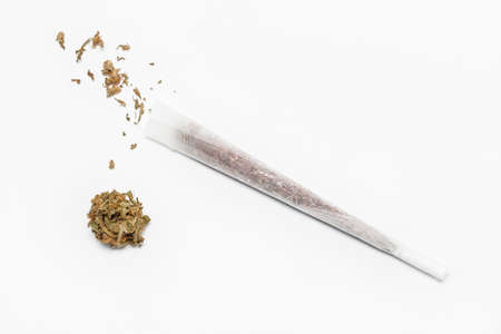 Preparing a cannabis joint with tobacco and rolling paper on white background - top viewの写真素材