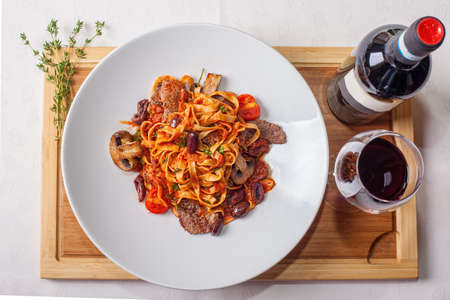 Roasted beef with tagliatelle Mediterranean styleの写真素材