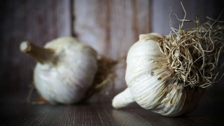 garlic on the wooden table, wooden background