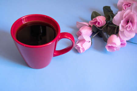 cup of coffee on blue backgroundの写真素材