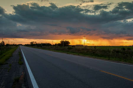 late afternoon on the highway with clouds in the background in Santa VitÃ³ria do Palmarの写真素材