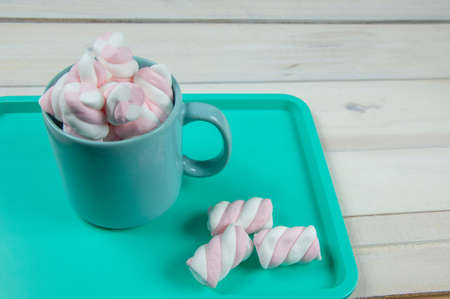 sweet pink marshmallows on a wooden floorの写真素材
