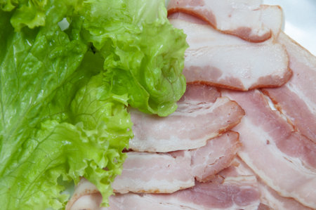 Delicious bacon on top of a white backgroundの写真素材