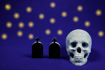 Halloween skull and tombstones with purple backgroundの写真素材