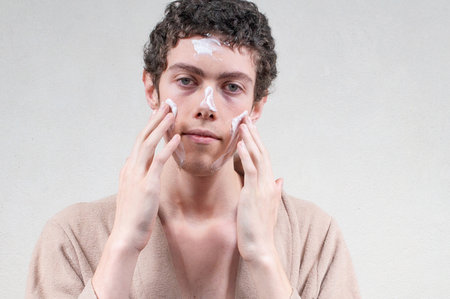 Young man taking care of the skinの写真素材