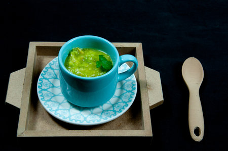 Delicious guacamole on top of a black backgroundの写真素材