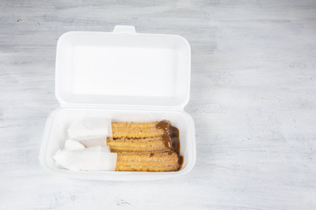 delicious churros on the tableの写真素材