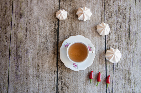 vintage tea cup with meringues aroundの写真素材