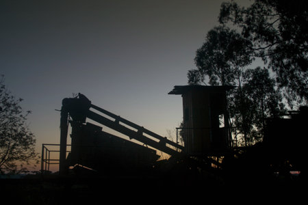 Silhouette of an old coal mine in the evening light.