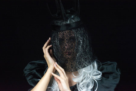 Portrait of a witch in a black dress, Halloween conceptの写真素材