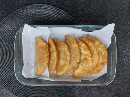 fried pastry on a black background